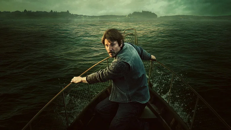 Josh Hartnett's fisherman character rowing across dark coastal water in Below